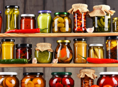 Food in jars on a shelf in a pantry